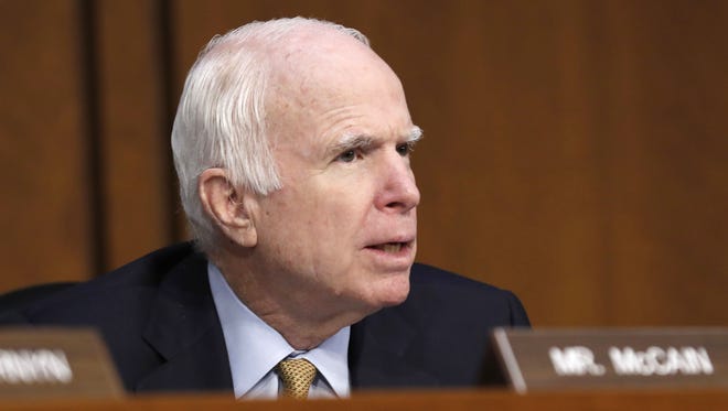 Sen. John McCain, R-Ariz., questions former FBI Director James Comey on Capitol Hill on June 8, 2017, during a Senate Intelligence Committee hearing to discuss his interactions with President Donald Trump.