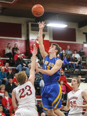 Grant Moeves of Newport Central Catholic puts up a floater over a Beechwood defender during the second quarter.