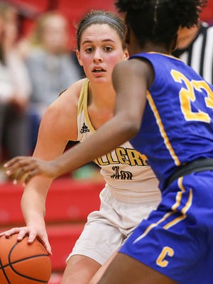 Noblesville' Emily Kiser will play basketball at Michigan next season, but she has fond memories of her swimming and volleyball days.