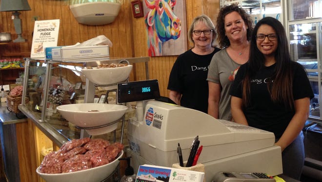 Owner Kelli Baustert (center) poses with employees Nancy Johnston (left) and Selena Sanchez at the fudge counter at Valley Pecans in Chillicothe. As the sign out front so aptly pronounces, the gift shop, eatery, candy store and pecan shop is "is not just nuts."
