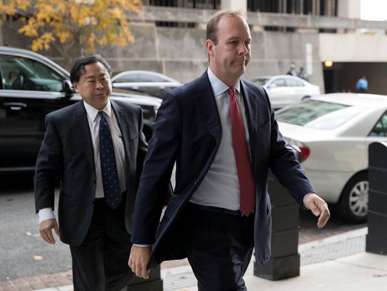 Rick Gates (R) arrives for a bond hearing at the E.