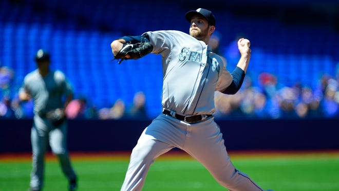 Seattle Mariners starting pitcher James Paxton throws during the first inning of a baseball game against the Toronto Blue Jays, Saturday, May 23, 2015, in Toronto.