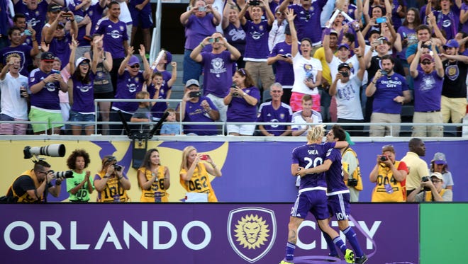 Jun 14, 2015; Orlando, FL, USA; Orlando City SC midfielder Kaka (10) reacts with midfielder/defender Brek Shea (20) after he scored a goal against the D.C. United during the first half at Orlando Citrus Bowl Stadium. Mandatory Credit: Kim Klement-USA TODAY Sports