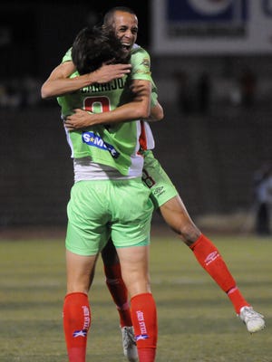 The Bravos' Wanderley de Jesus hugs striker Leandro Carrijo following a first-half goal against the Cimarrones de Sonora Saturday night in Juárez.