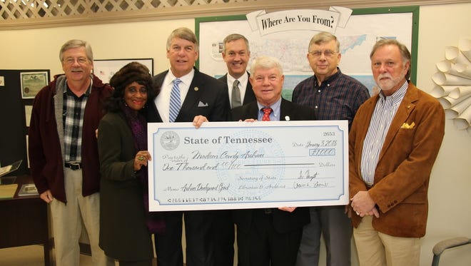 From left: Jack Wood, Jackson-Madison County Library Tennessee Room Manager; Katie Y. Brantley, Madison County commissioner; Sen. Ed Jackson (R-Jackson); Secretary of State Tre Hargett; Rep. Jimmy Eldridge (R-Jackson); Thomas Aud, Madison County archivist; and Madison County Mayor Jimmy Harris gather for the awarding of a $1,000 grant to the Madison County Archives.