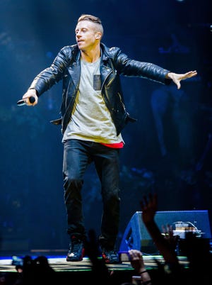 Macklemore performs during a concert at the Heineken Music Hall in Amsterdam, on September 18, 2013.