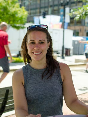 Karla Smith, 32, of Des Moines, taking in the shade