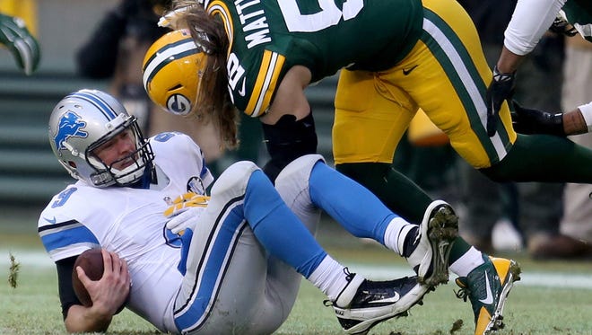 Detroit Lions' Matthew Stafford is sacked by the Green Bay Packers' Clay Matthews during first quarter action Sunday, Dec. 28, 2014 at Lambeau Field in Green Bay, Wis. The Packers won 30-20.