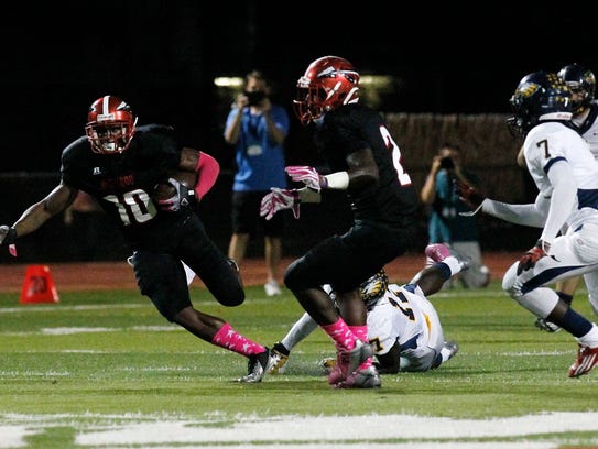 Immokalee High School's J.C. Jackson (10) makes his