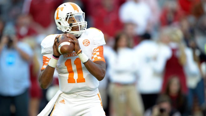 Tennessee Volunteers quarterback Joshua Dobbs (11) drops back to pass against the Alabama Crimson Tide during the first quarter at Bryant-Denny Stadium.