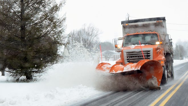 A DelDOT snow plow working its way south on Rt. 15 in Milford.