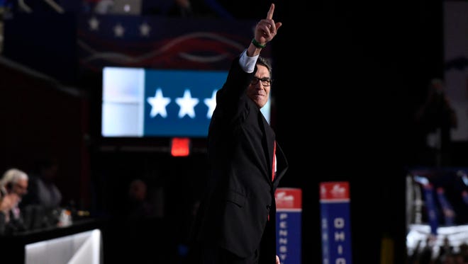 Former Texas governor Rick Perry greets the crowd during the 2016 Republican National Convention in Cleveland July 18, 2016.