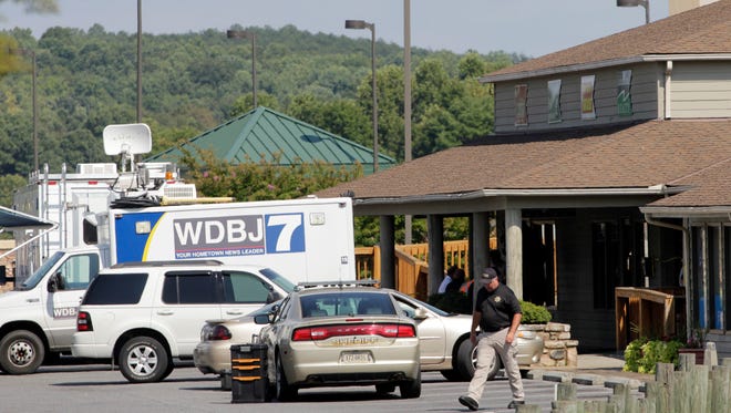 The TV truck that journalists Alison Parker and Adam Ward drove before they were killed the morning of Aug. 26, 2015, for a live broadcast sits in a parking lot near the scene in Moneta, Virginia.