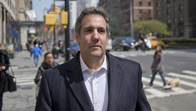 In this April 11, 2018, file photo, attorney Michael Cohen walks down the sidewalk in New York. Two months before the 2016 election, Donald Trump and his former lawyer Cohen discussed plans to pay for a former Playboy model's story of alleged an affair, according to a secretly recorded tape of the conversation released amid an escalating feud between the president and his longtime personal attorney.