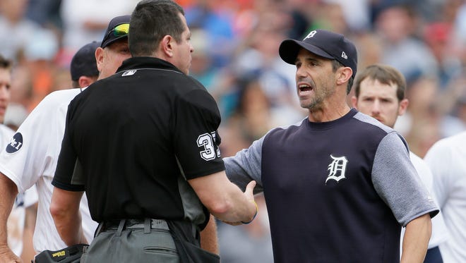 Detroit Tigers' Brad Ausmus, right, talks with home plate umpire Carlos Torres after Detroit's James McCann was hit by a pitch during the seventh inning of a baseball game against the New York Yankees on Thursday, Aug. 24, 2017, in Detroit. The Tigers won 10-6.