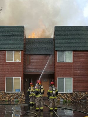 South Lake Tahoe firefighters battle a blaze a Tahoe Keys condominium on Tuesday.
