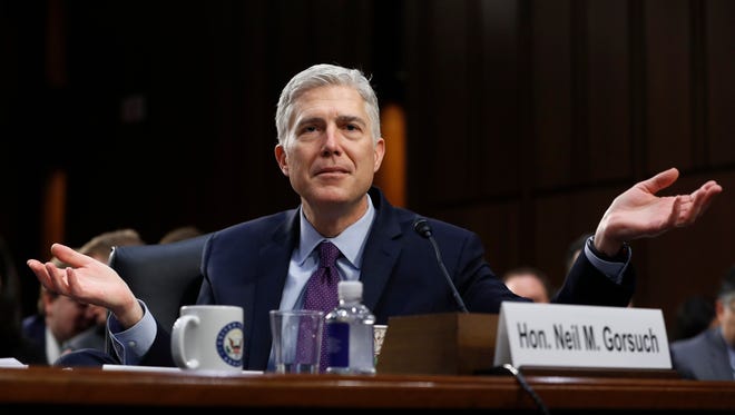 Supreme Court Justice nominee Neil Gorsuch gestures as he testifies on Capitol Hill in Washington, Tuesday, March 21, 2017, at his confirmation hearing before the Senate Judiciary Committee.