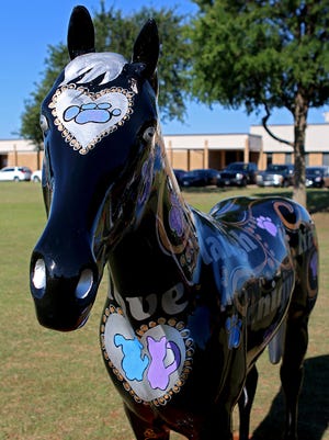 The Mane Event horse "Forever," inspired by Lauren Landavazo and Makayla Smith, sits outside McNiel Middle School Wednesday morning.