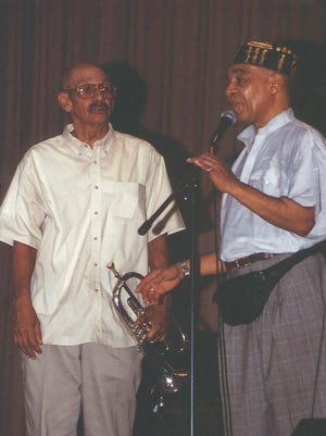 Trumpet player Arnold DePass, left, is show on stage with longtime friend and musician Benny Powell.