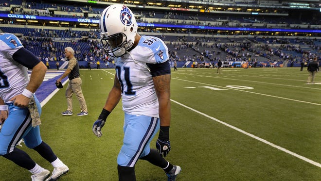 Titans outside linebacker Derrick Morgan (91) walks off the field after the game Sunday.