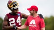 Aug. 8: Cornerback Josh Norman hangs with fan and NASCAR