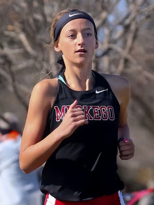Muskego freshman Kate Jochims breezes to victory in the 5000 meter girls race during the Classic 8 Conference cross country meet at Lake Denoon Middle School Saturday, October 17, 2015.