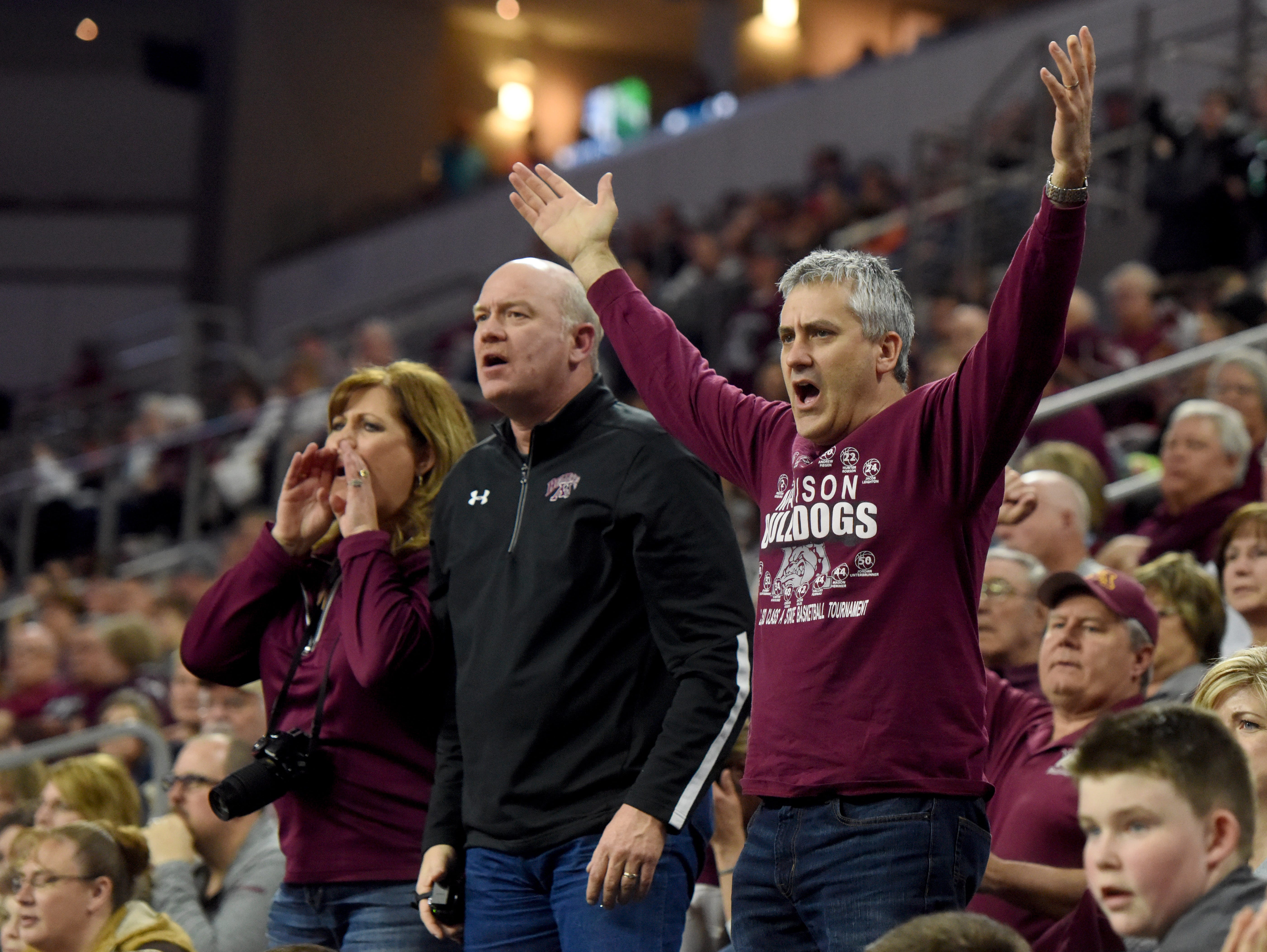 Madison fans react to a ref's call against Tea Area during the 2017 SDHSAA Class A boy's basketball championship at the Denny Sanford Premier Center on Saturday, March 18, 2017.