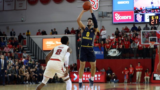 Marquette's Markus Howard shoots over St. John's guard Shamorie Ponds in last season's matchup at Carnesecca Arena.