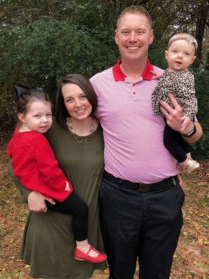 James Thurn, with wife Jenna, and daughters Harper, left, and Ryleigh, is the new football coach at Blue Ridge High School.
