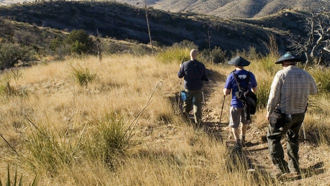 Ben Cane (left), Mike Armstrong (center) and Yancey Herriage (right) on the first leg of the Arizona Trail, walking down the Mexican border.