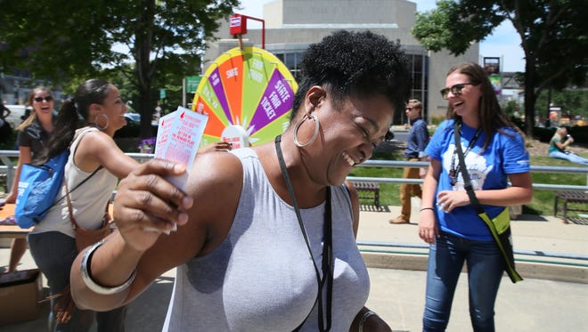 Nia Hardison can't believe her good luck as she wins two tickets to the Wisconsin State Fair by spinning a prize wheel. Kathy Thornton (left), the next in line, won a coupon book. Milwaukee Downtown Business Improvement District #21 collaborated with downtown businesses and community leaders to reward the downtown workforce during the 12th Annual Downtown Employee Appreciation Week. The event includes games, lunchtime giveaways and exclusive discounts for the 83,490-plus employees downtown.