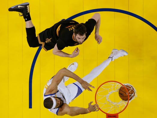 JaVale McGee dunks as Kevin Love looks on in Game 2.