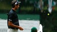 Bubba Watson watches as his son throws a ball in the