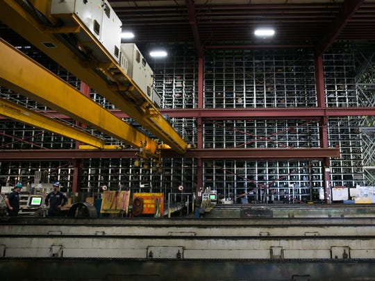 Cranes are used to access large storage spaces at Klein Steel in Rochester. The company said the trade war with China has led to uncertainty for its business.