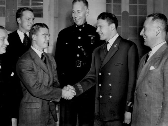 Dec. 7, 1939 - Nile Kinnick shakes hands with Navy