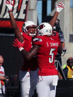 Louisville's Des Fitzpatrick celebrates with Seth Dawkins after he catches a touchdown against Murray State. 
