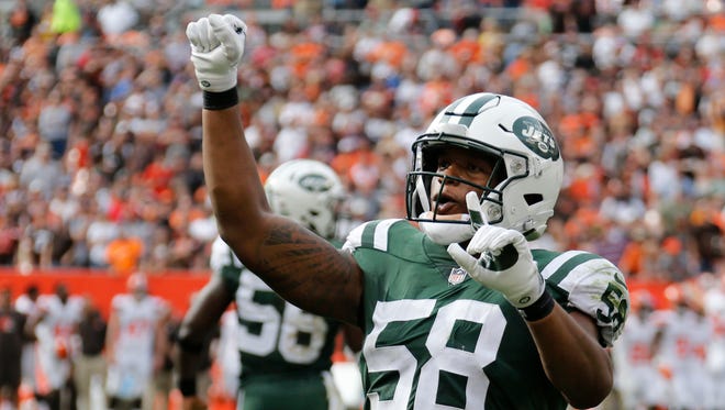 New York Jets inside linebacker Darron Lee celebrates after stopping the Cleveland Browns on 4th and one during the second half of an NFL football game, Sunday, Oct. 8, 2017, in Cleveland. (AP Photo/Ron Schwane)