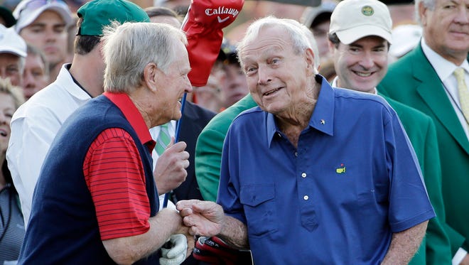 Arnold Palmer, right, talks to Jack Nicklaus after hitting on the first tee for the honorary tee off before the first round of the Masters golf tournament Thursday, April 9, 2015, in Augusta, Ga. (AP Photo/David J. Phillip)