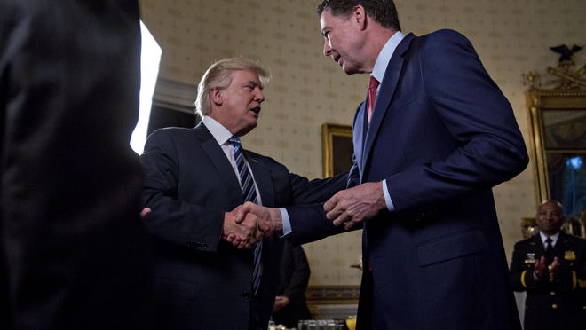 Andrew Harrer/Getty ImagesPresident Donald Trump shakes hands with FBI Director James Comey on Feb.22. Two days after firing him this week, Trump now says Comey was a “showboat” and a “grandstander.” Andrew Harrer/Getty ImagesPresident Donald Trump reportedly has asked FBI Director James Comey, right, to stay on. Trump had criticized Comey during the campaign. WASHINGTON, DC - JANUARY 22: U.S. President Donald Trump (C) shakes hands with James Comey, director of the Federal Bureau of Investigation (FBI), during an Inaugural Law Enforcement Officers and First Responders Reception in the Blue Room of the White House on January 22, 2017 in Washington, DC. Trump today mocked protesters who gathered for large demonstrations across the U.S. and the world on Saturday to signal discontent with his leadership, but later offered a more conciliatory tone, saying he recognized such marches as a "hallmark of our democracy." (Photo by Andrew Harrer-Pool/Getty Images)