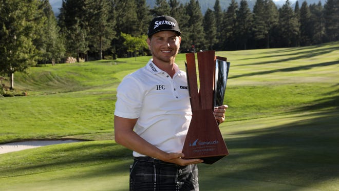 Chris Stroud poses with the trophy after winning the Barracuda Championship at Montreux Golf & Country Club on Aug 6.