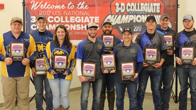 Boonville High grads Tristan Whalen (center mid) and John Whalen of Southeastern Illinois College display USA Archery National Collegiate Championship awards.