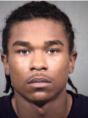 Almalik Ward, 21, is believed to have shot two men at a Walmart in Glendale before fleeing the scene, officials said.