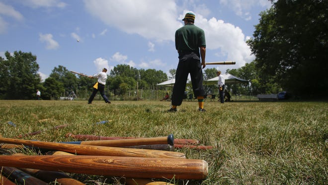 Old time base ball club players use tin cups for water, wear vintage uniforms, use wooden bats san leather baseball gloves, and play with1860-era baseballs which give authenticiy to their old time base ball clubs.