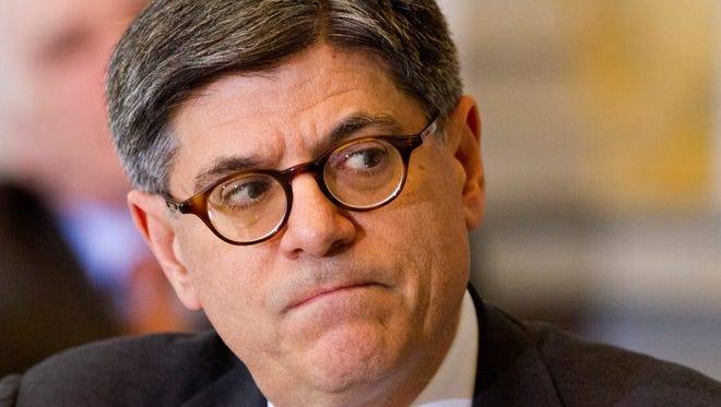 In this Dec. 18, 2014 file photo, Treasury Secretary Jacob Lew listens during an open session of the Financial Stability Oversight Council at the Treasury Department in Washington.
