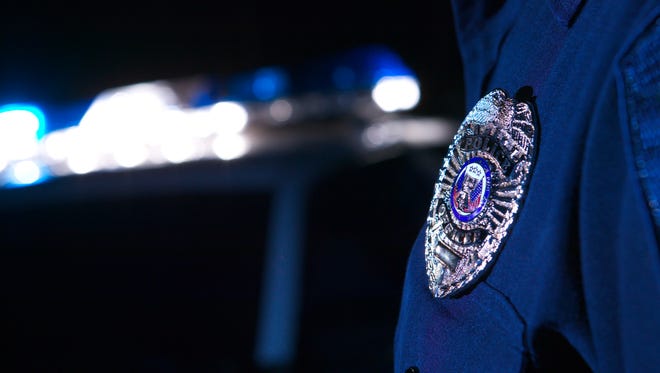 A file photo of a police officer's badge. Reno police are investigating a fatal drive-by shooting that killed a 19-year-old woman over the weekend.