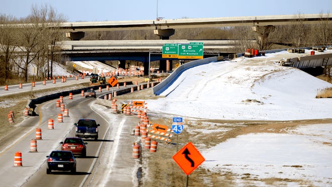 Northbound Interstate 43 traffic winds approaches the U.S. 41 interchange with construction zone on Friday in Howard.