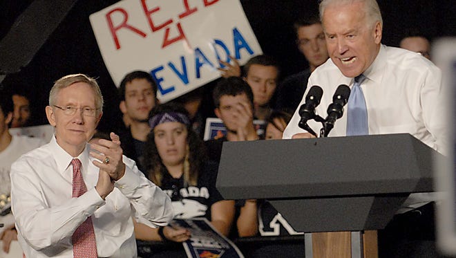 Sen. Harry Reid, left, applauds comments by Vice Pres. Joe Biden Wednesday Oct. 20, 2010 during a rally at UNR Wednesday Oct. 20, 2010. Marilyn Newton/RGJ