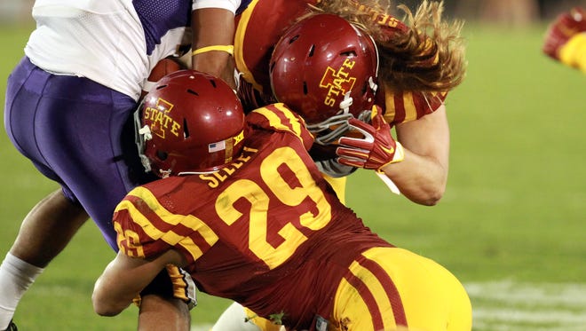 Northern Iowa Panthers Michael Malloy (31) is tackled by Iowa State Cyclones linebacker Kane Seeley (29) and linebacker Sam Seonbuchner (47) at Jack Trice Stadium last season.