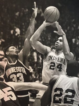 Daryl Thomas gets off a one-handed shot in the lane as Minnesota's Richard Coffey tries for a block in 1987.