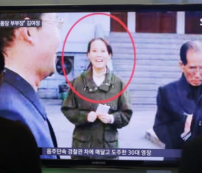 People watch a TV news program showing Kim Yo Jong, North Korean leader Kim Jong Un's younger sister, at Seoul Railway Station in Seoul, South Korea, on Nov. 27, 2014.